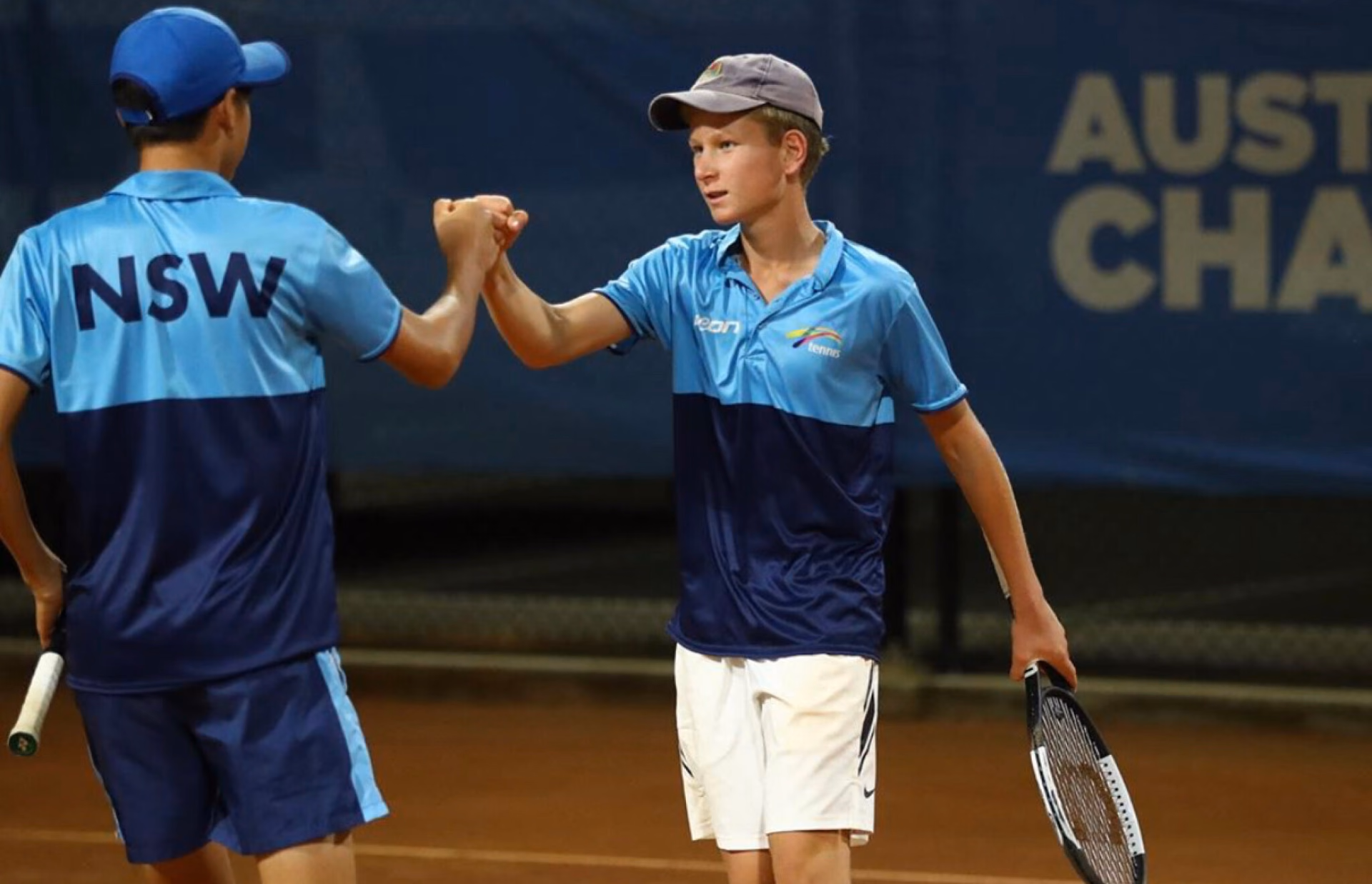 Tennis players wearing blue Icon Sports uniforms